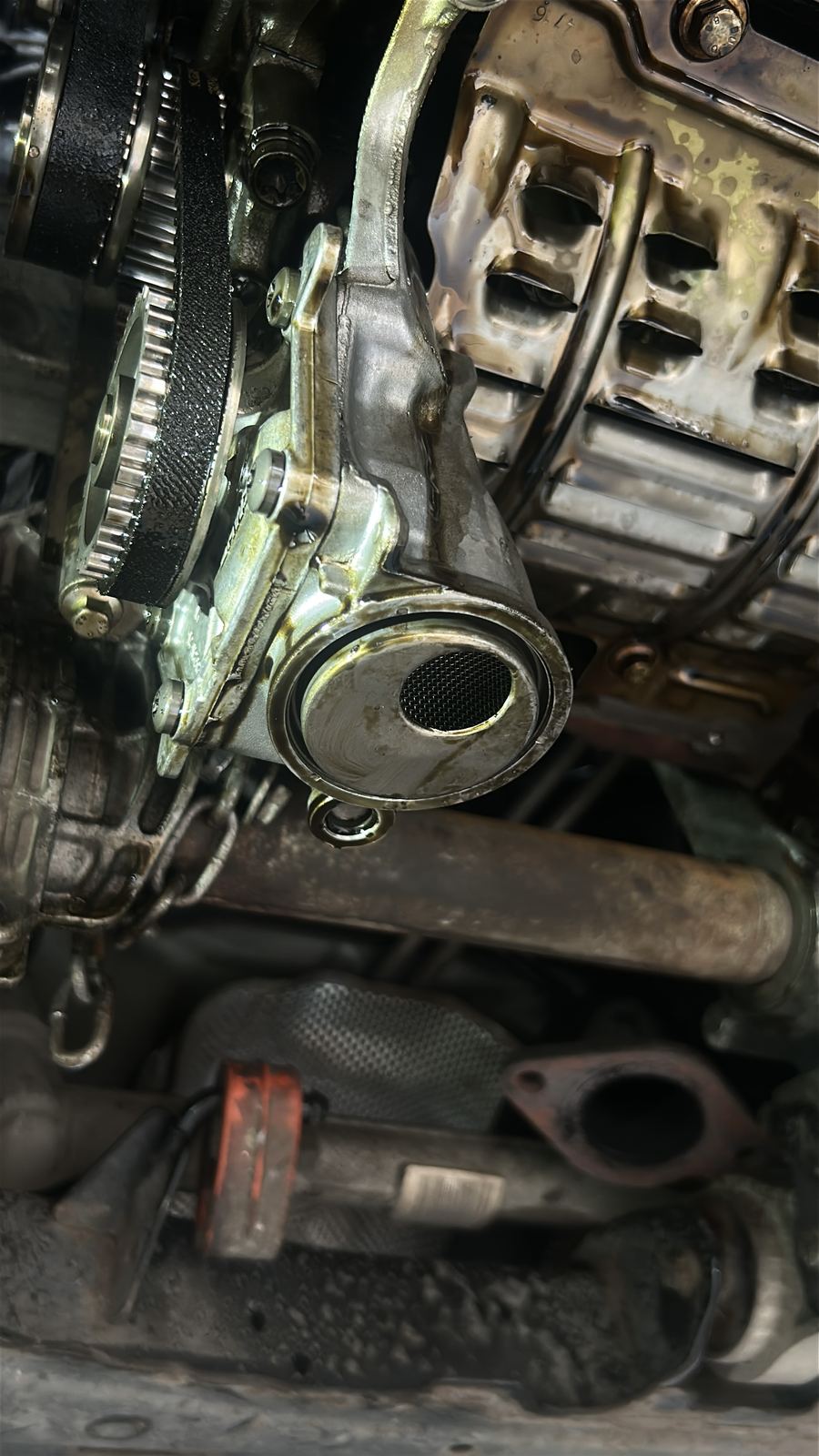 Oil pump and clean pickup strainer refitted underneath the engine